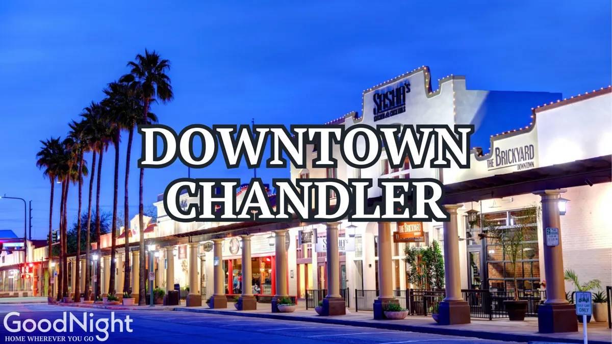 A vibrant exterior scene of Mill Avenue, featuring palm trees, storefronts, signage, and outdoor seating bustling with activity. The image evokes the lively dining and shopping atmosphere of Tempe’s central district.