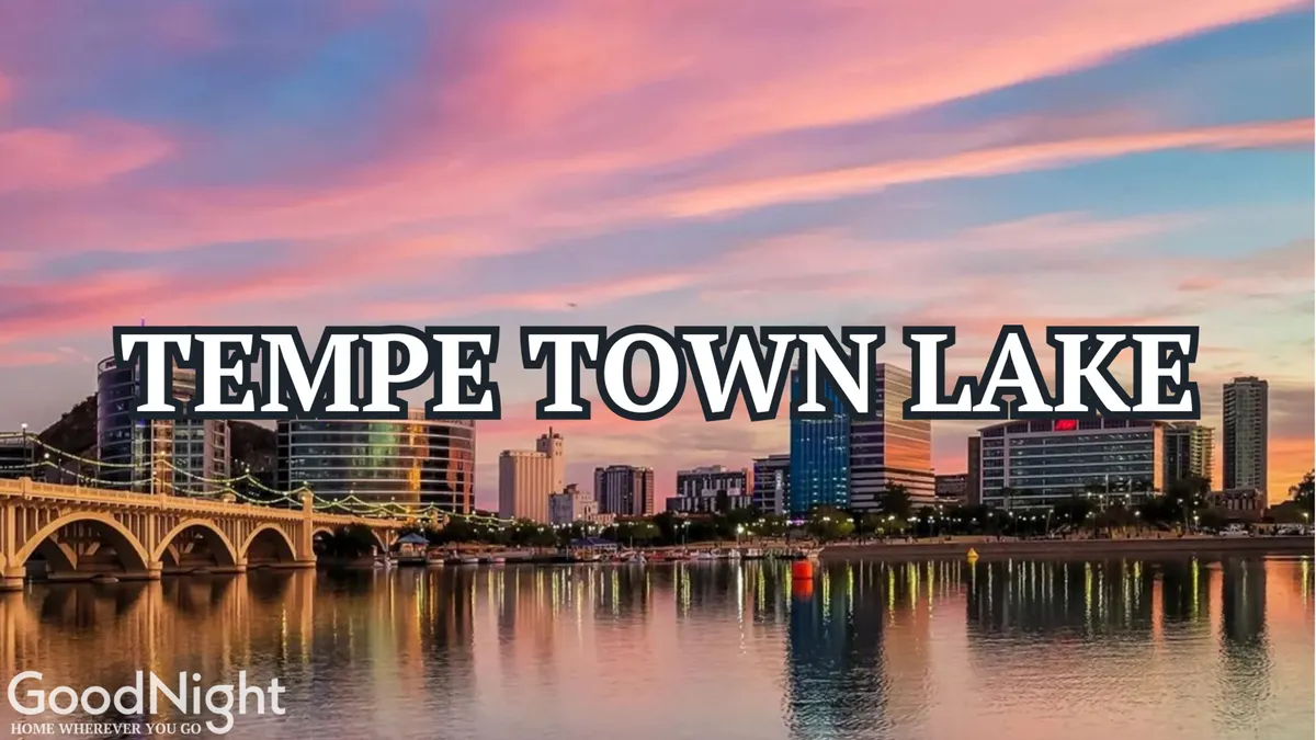 A wide view of Tempe Town Lake with a vibrant city skyline and a glowing sunset sky. The lake is a centerpiece for recreational activities, and the tranquil setting invites exploration and outdoor enjoyment.